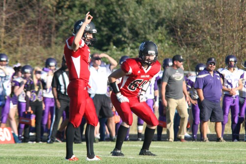Wolf QB Joel Walstad prepares to kick off while Matt Shank (Photos courtesy Renee Walstad)