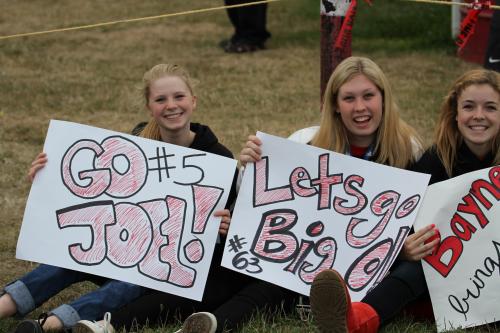 Never too busy to make signs. It's (l to r) CHS volleyball players Ally Roberts, Sydney Autio and Kacie Kiel.