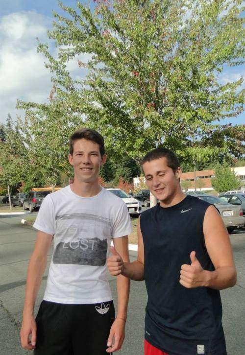 Loren Nelson (left) and Kyle Bodamer react to their win at first doubles.