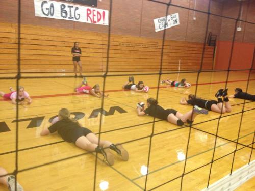 Players hit the floor during a drill.