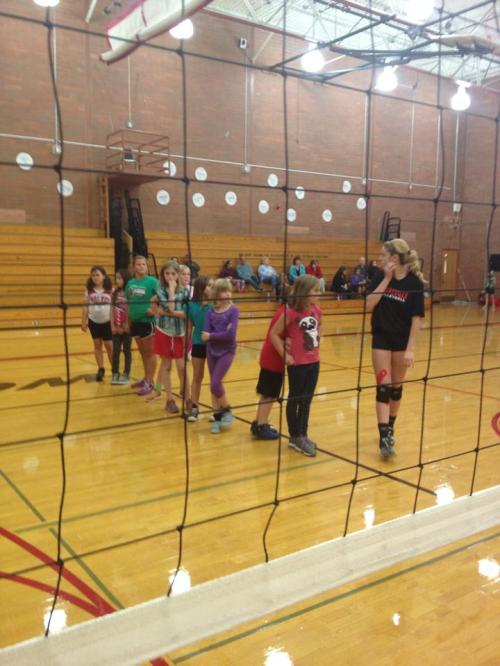 CHS senior Kacie Kiel leads a group of young volleyball players.