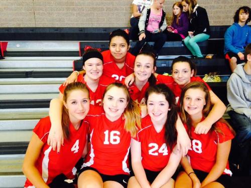 Smith (4) and some of her Wolf teammates hang out before their final match.