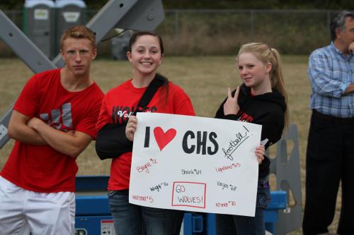 Super fans (l to r) Dalton Martin, Bailey and Ally Roberts hang out during a football game.