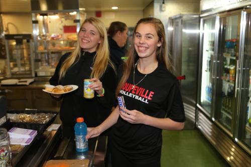 Tiffany (left) and Kyla Briscoe grab a snack.