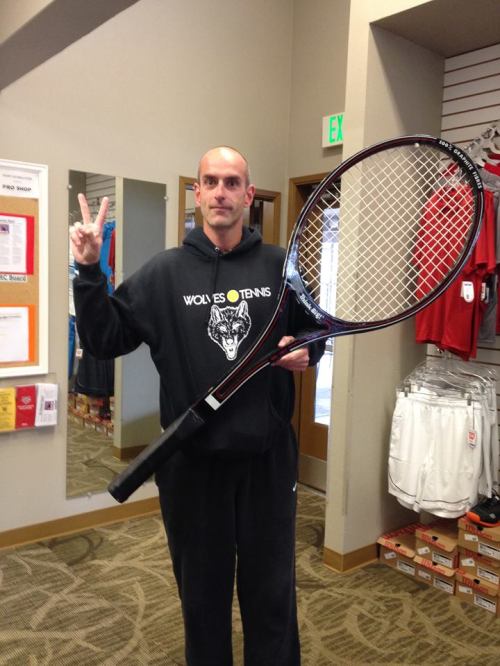 CHS tennis coach Ken Stange carries a big racket and teaches his players how to use it.