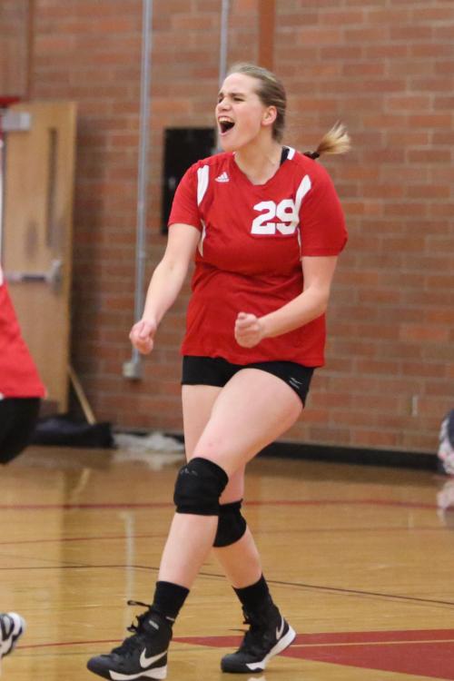 Wolf senior Monica Vidoni celebrates after one of her two service aces. (John Fisken photos)