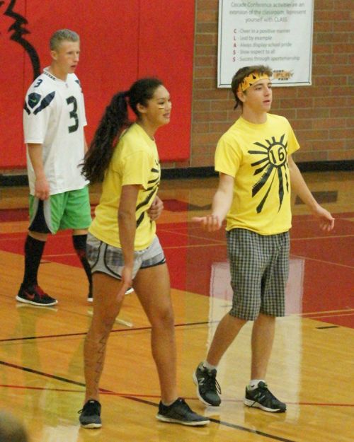 Junior Sebastian Davis (right) congratulates Makana Stone as Dalton Martin patrols the back line.