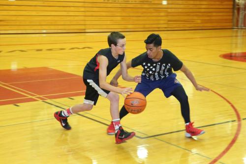 Johnson shadows Wolf freshman Nick Etzell.
