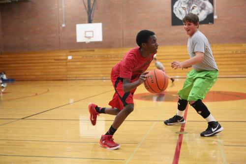 Dante Mitchell drives on James Vidoni during a drill.