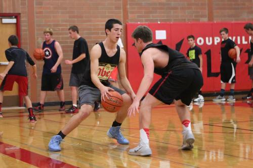 Ryan Griggs drives on Matt Shank.