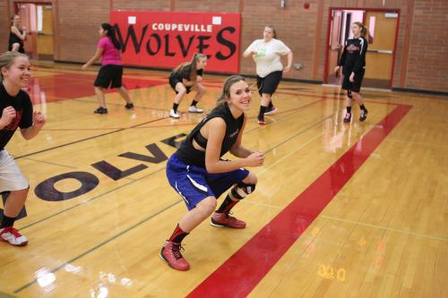 Julia Myers (right) and Lauren Rose grin and bear it during conditioning drills.