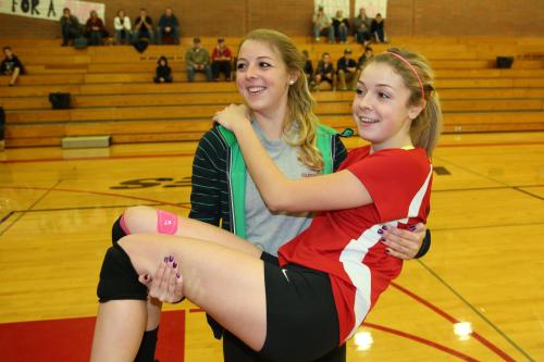 Katie Kiel carries lil' sis Kacie around for a victory lap on Senior Night.