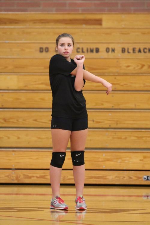 After seeing that, Maggie Crimmins makes sure to get properly stretched. 