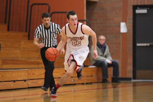 Aaron Curtin flies up the court, on his way to scoring two of his team-high 13.