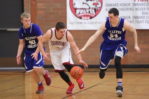 Wiley Hesselgrave nimbly keeps the ball away from a pair of defenders.