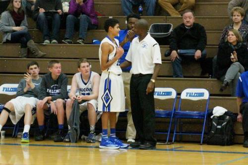 Pope discusses strategy with new SWHS coach Mike Washington, who moved down the Island after eight seasons in Oak Harbor.
