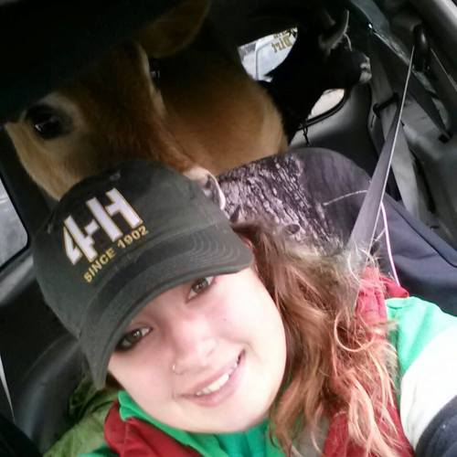 Elizabeth Bishop out for as drive with one of her 4-H animals.