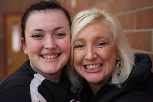 Former CHS cheer coach Sylvia Arnold (right) hangs out with Hailey Hammer. (John Fisken photos)