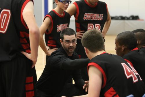 Wolf JV coach Dustin Van Velkinburgh talks strategy with his troops. (Madeline Strasburg photo)