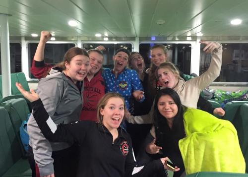 The Wolf JV celebrates during their final ferry ride of the season. (Amy King photo)