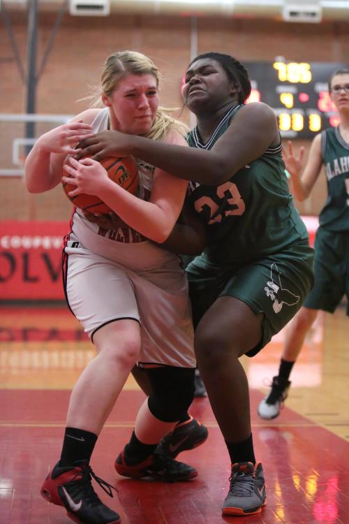 The Wolf JV team, featuring brawlers like Tiffany Briscoe (left) also went 9-0 in league play. (John Fisken photos)