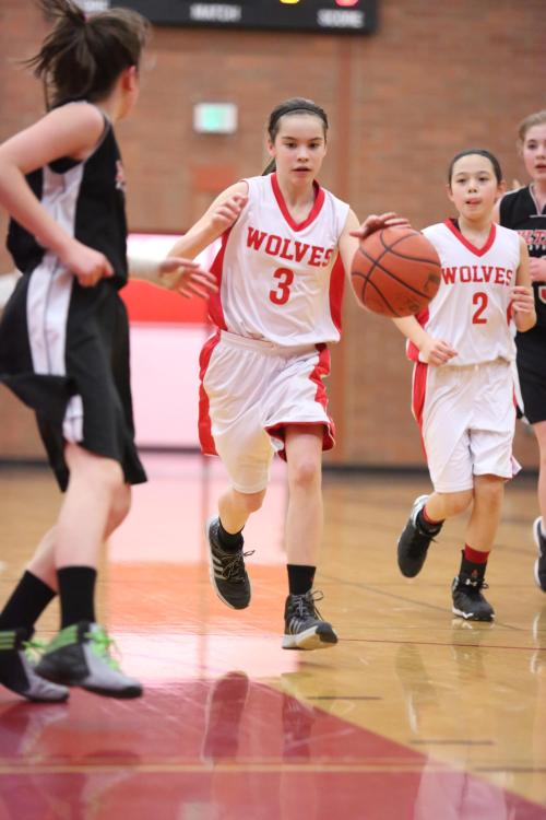 Maya Toomey-Stout (3) pushes the fast break, with Scout Smith coming up on the outside. 