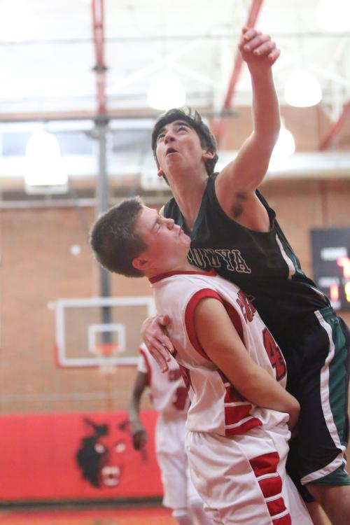 Hunter Downes (left) got back on defense and drew a charging foul on his opponent, proof of why he was a Mr. Hustle.