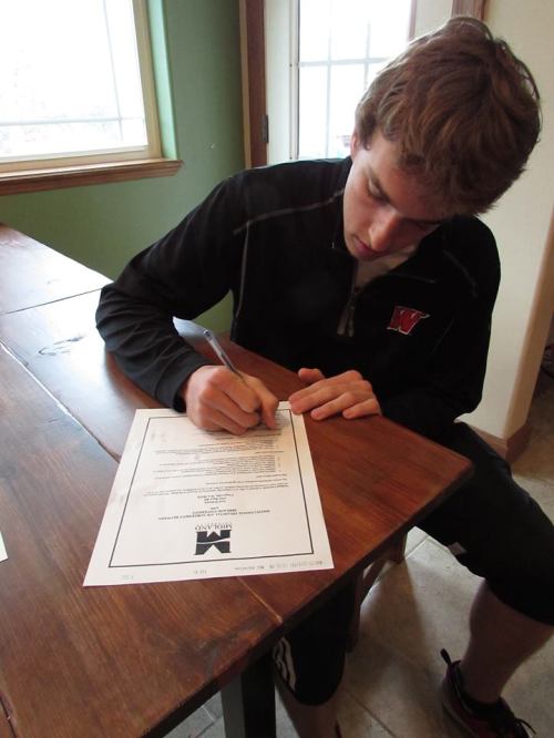 Walstad signs his letter of intent. (Shawn Walstad photo)