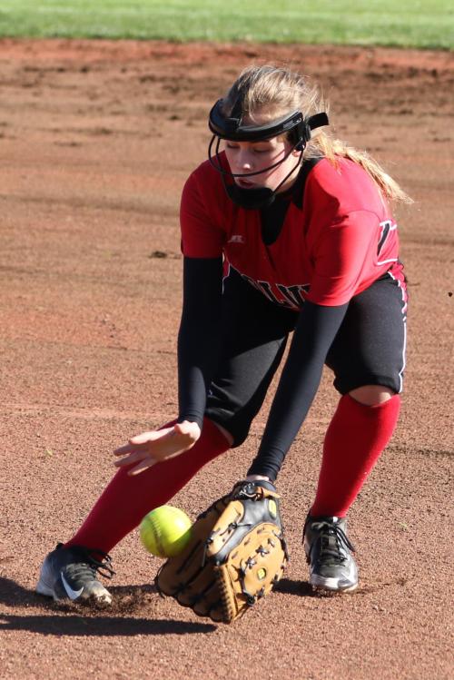 Kyla Briscoe sweeps up a ball at first. (John Fisken photos)