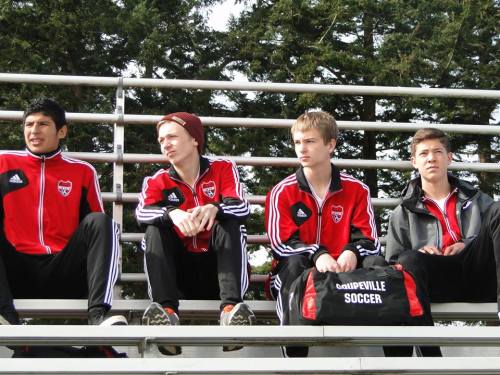Wolf soccer players watch action during Saturday's jamboree. (Wendy McCormick photo)
