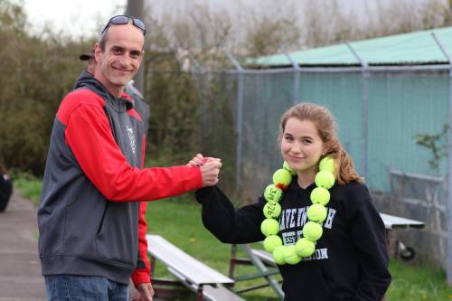 CHS coach Ken Stange congratulates Player of the Match Valen Trujillo.