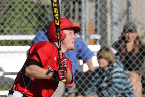 Aaron Curtin watches an RBI double fly off his bat.