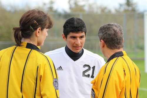 The refs stop Abraham Leyva to ask for his autograph.