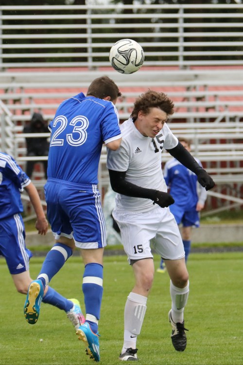 Colin Belliveau (15) drops the boom on a pesky foe. (John Fisken photos)
