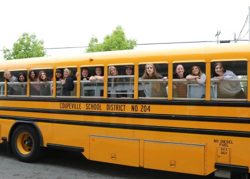 The wheels on Coupeville buses (this one was headed to state for softball) go round and round, driven by the best in the biz. (John Fisken photo)