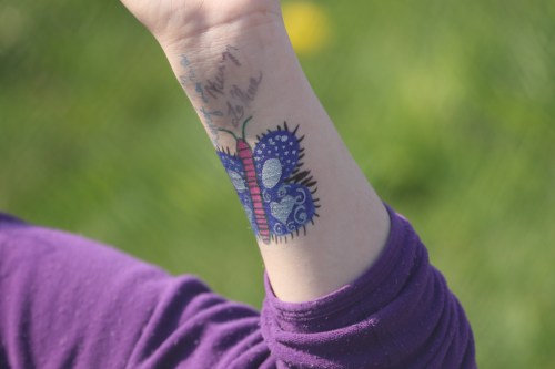 Kenzi LaRue shakes up the dress code with some arm art.