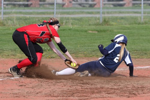 Monica Vidoni (left) owns third base and she's not in a mood to let any pesky runners claim the bag.