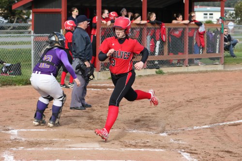 McKayla "Twinkle Toes" Bailey flies across home plate with a run. (John Fisken photos)