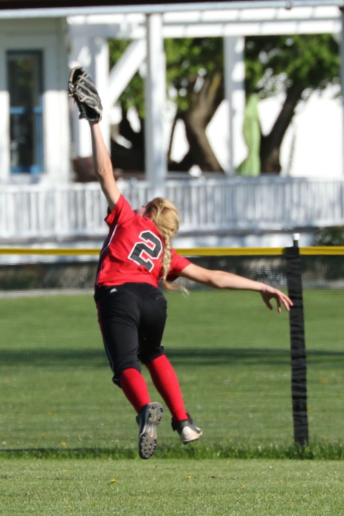 The Surgeon operates. Hope Lodell, having put the pedal through the metal, makes a spectacular catch in the deepest, darkest part of centerfield.