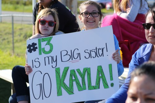 McKenzie Bailey (right) supports big sis McKayla, who was making her first start in the pitcher's circle