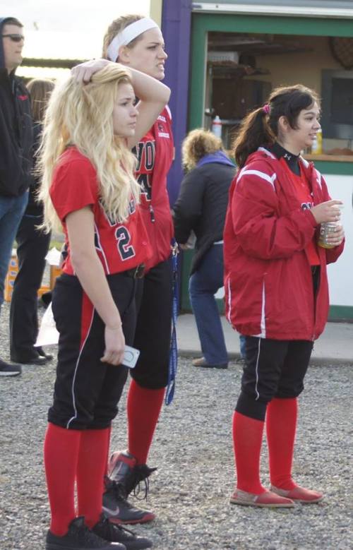 Wolf softball players (l to r) Hope Lodell, Monica Vidoni and Robin Cedillo watch their school's baseball team play. (Shelli Trumbull photo)