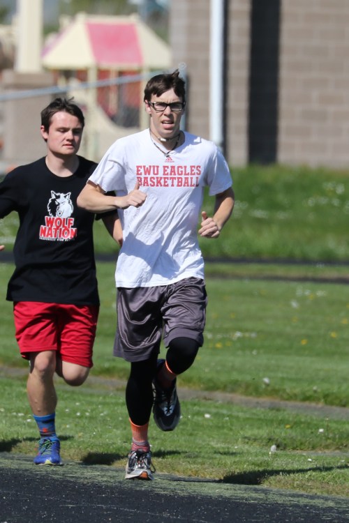 Jared Helmstadter (front) set a PR in the 200 Saturday at the District 3 meet. (John Fisken p[hotos)