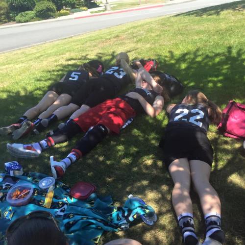 Players rest in the shade between games.