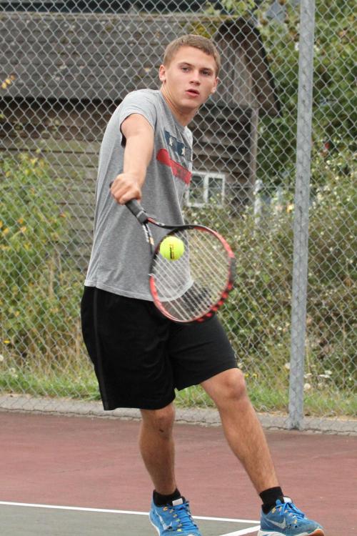 Jimmy Myers rips a shot on the tennis court. (John Fisken photos)
