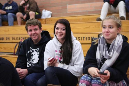 Welling hangs out at a Wolf basketball game with Katrina McGranahan (center) and Mckenzie Meyer.