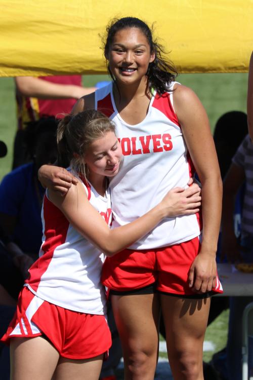 Sylvia Hurlbuet (left) and Makana Stone hug it out on the awards stand.