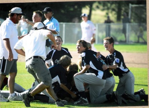 Chris Tumblin (left) prepares to join the dog-pile after winning a state title.