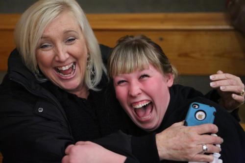 Former CHS cheer coach Sylvia Arnold (left) shares a moment with Sydney Autio (john Fisken photos)