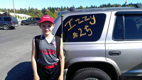 Isabelle Wells gets ready to nring a big bat and slick glove to the field. (Katy Wells photo)