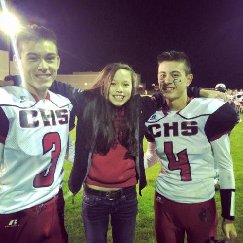 Scout Smith snags a photo op with older brothers CJ (left) and Hunter after their season-opening game. (Charlotte Smith)